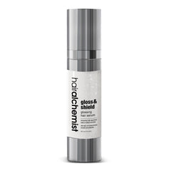 Hair alchemist gloss & shield hair serum bottle on a white background