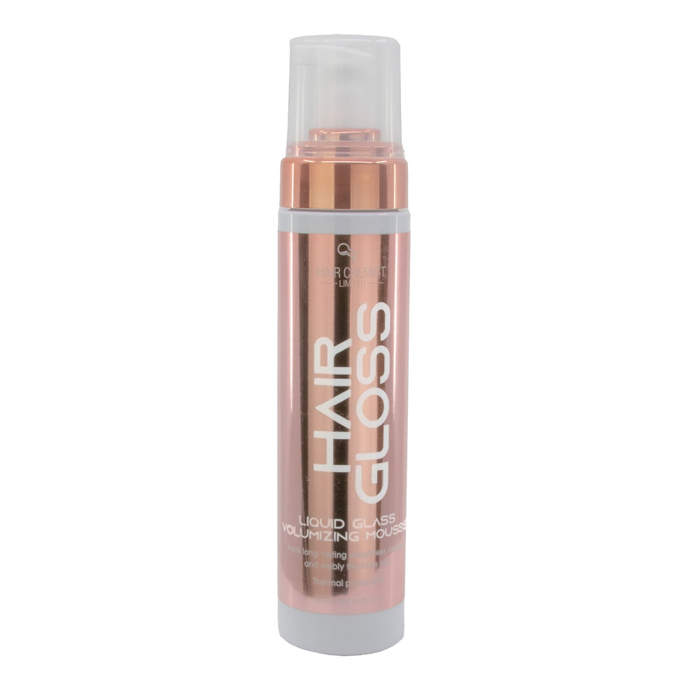 Hair gloss bottle with rose gold and white design on a white background