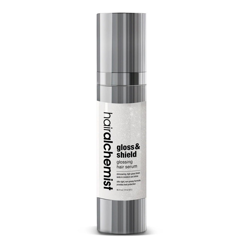 Hair alchemist gloss & shield hair serum bottle on a white background
