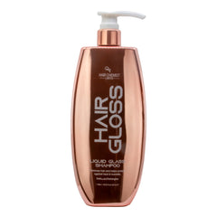 Rose gold shampoo bottle with white pump labeled 'Hair Chemist' on a white background