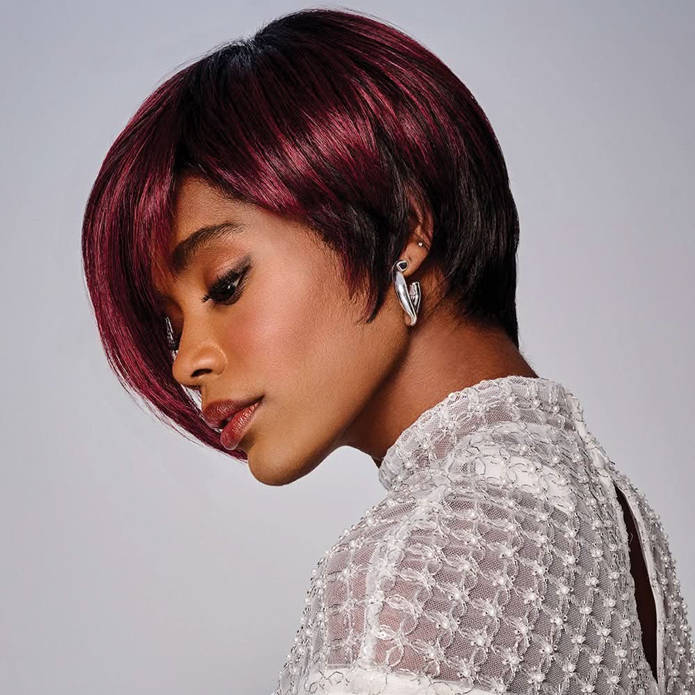 Woman wearing Anastasia Wig in Sangria while tilting her head down - Left side profile view